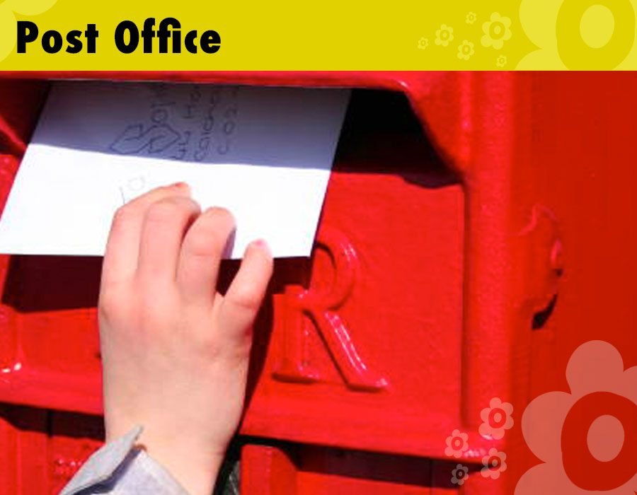 Children's post letters outside the role play post office ready for their new friends to sort.