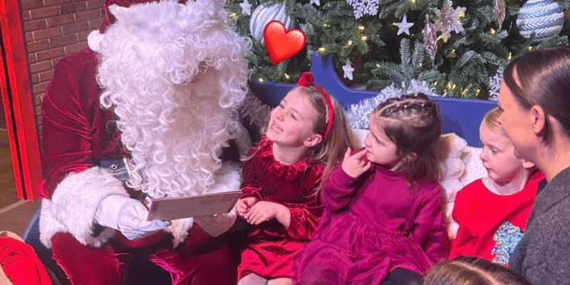 Children share their letters with santa in our role play village