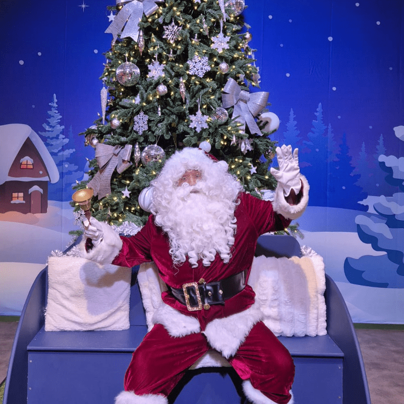 Father Christmas visits children and hands out gifts